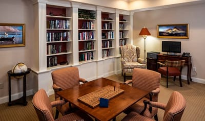Cozy common area with bookshelves and seating