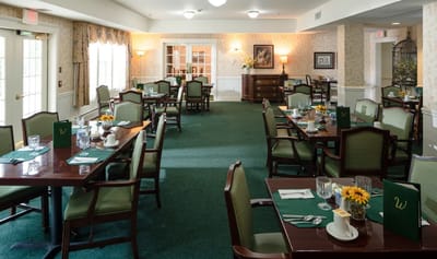 Dining room with tables set for a meal