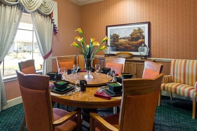 Dining table set up with tableware and flowers