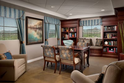 Cozy common area with bookshelves and artwork