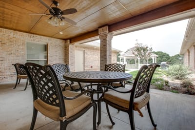 Outdoor seating area with a table and chairs