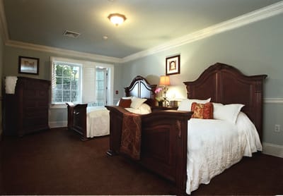 Cozy resident room with two beds and warm lighting