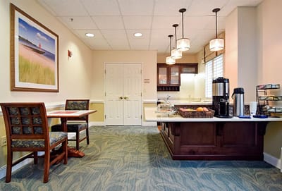 Bright common area with seating and refreshments