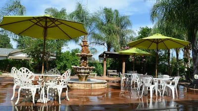 Outdoor patio area with a fountain and seating