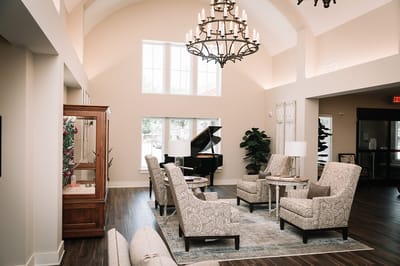 Bright interior lobby with comfortable seating and piano