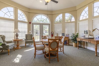 Bright interior common area with seating and windows