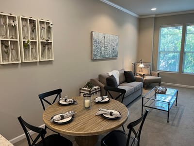 Dining area with table set for meals