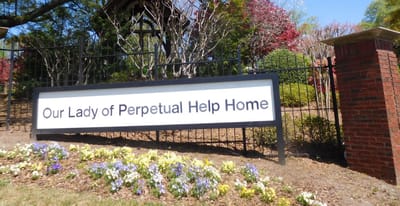 Signage of Our Lady of Perpetual Help Home at the facility entrance