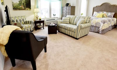 Bright and cozy resident room with seating area