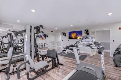 Well-equipped fitness room with exercise machines