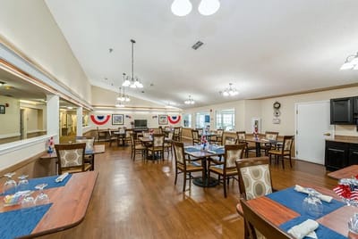 Bright dining room with tables set for meals