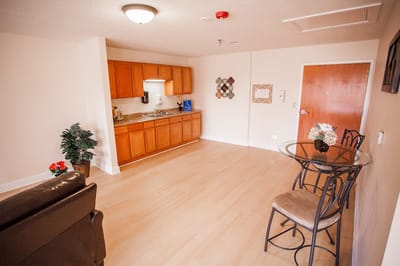 Cozy interior of a resident's room with kitchenette