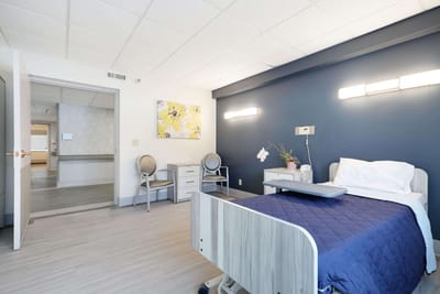 Private resident room with a bed and desk