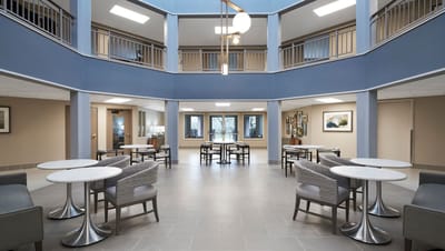 Bright common area with seating and tables
