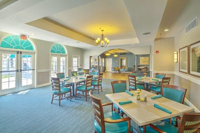 Interior of the dining room with tables and chairs