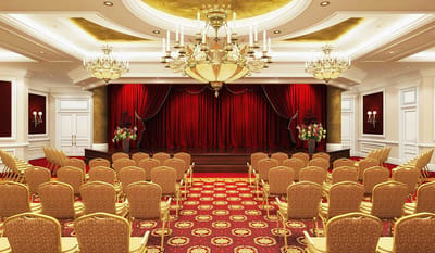 Elegant event space with chandeliers and seating