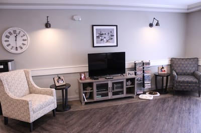 Cozy common area with seating and a TV