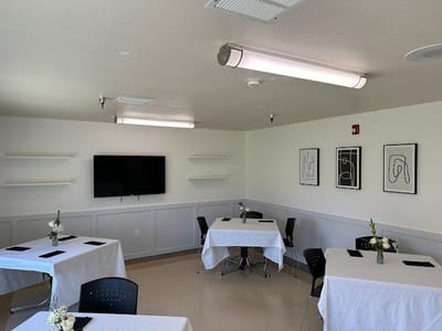 Bright activity room with tables set for events
