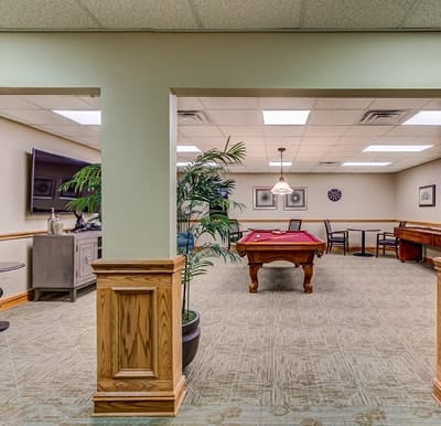 Interior of a common area with pool table and seating