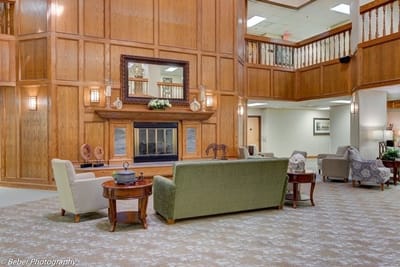 Lounge area with plush seating and wooden accents