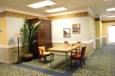 Common area with a table, chairs, and decor