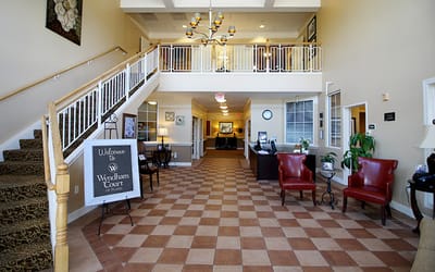 Lobby area with stairs and seating at Wyndham Court