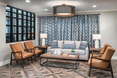 A cozy lounge area with seating and decorative lights