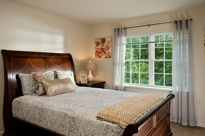 Cozy resident room with a window and bed