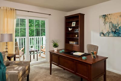 Bright interior office space with a view of outdoor balcony