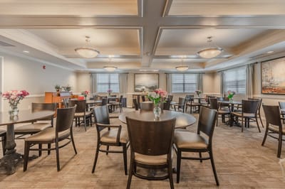 Bright dining room with tables and floral decorations