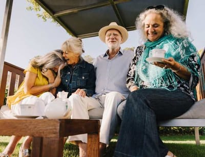 Four residents enjoying tea outdoors