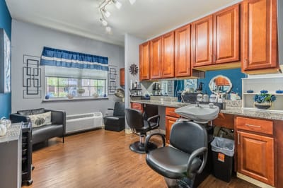 Hair salon area with styling chairs and mirrors