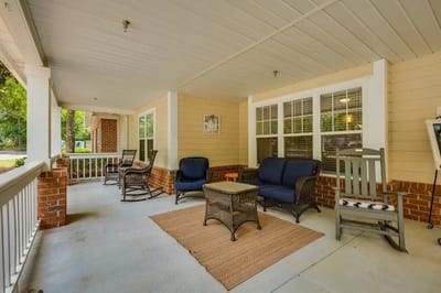 Covered porch area with seating furniture