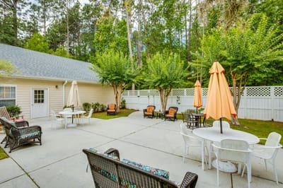 Outdoor seating area with umbrellas and greenery