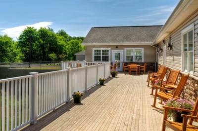 Outdoor patio with seating and gardens