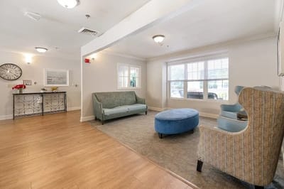 Bright common area with seating and natural light