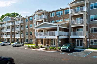 Exterior view of Glenmont Abbey Village with parking space