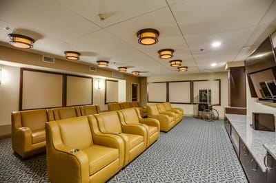 Common area with yellow seating and modern lighting