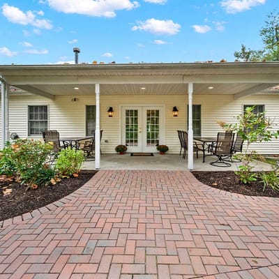 Outdoor patio area with seating and landscaping