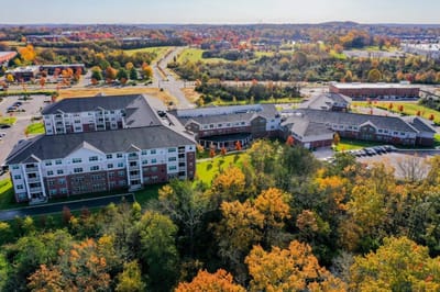 Aerial view of Clarendale at Indian Lake surrounded by fall foliage