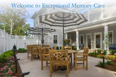 Outdoor seating area with umbrellas and landscaping