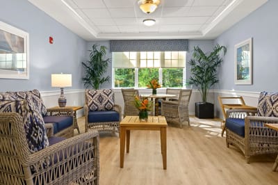 Bright common area with comfortable seating and plants