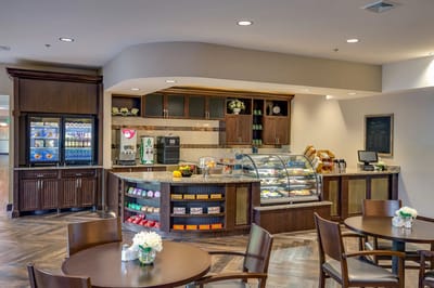 Interior view of a dining area with a dessert display