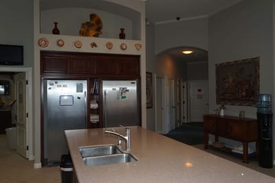 Warm interior kitchen area with cabinets and countertops