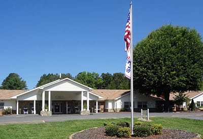 Exterior view of the retirement community with flagpole