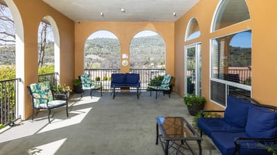 Outdoor seating area with a view of the hills