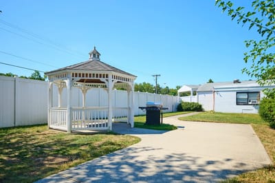A gazebo in an outdoor space at a senior care facility