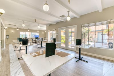 Interior view of a common area with tables and chairs