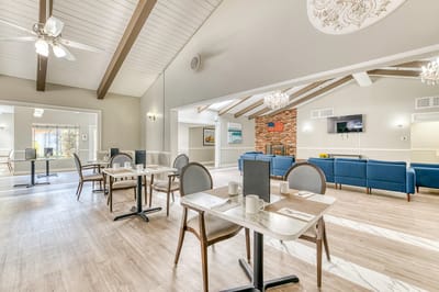 Bright dining area with tables and seating