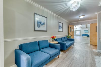 Interior view of a common area with blue sofas